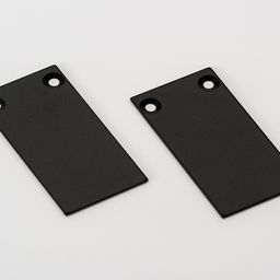 Две алюминиевые заглушки черные, вид сверху под углом