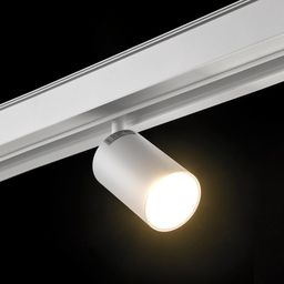 Белый спот на треке в включенном состоянии, теплый оттенок