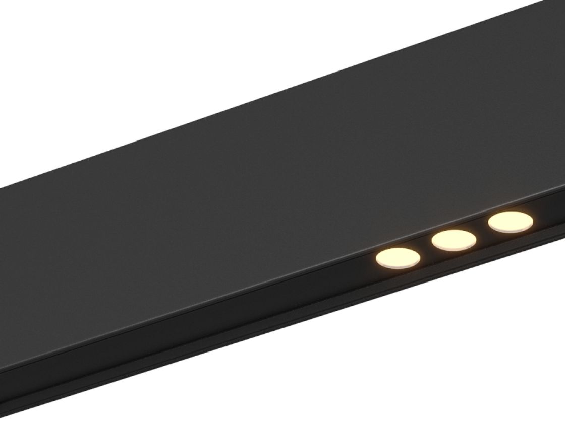 Крупный план светильника: черный профиль и теплый свет